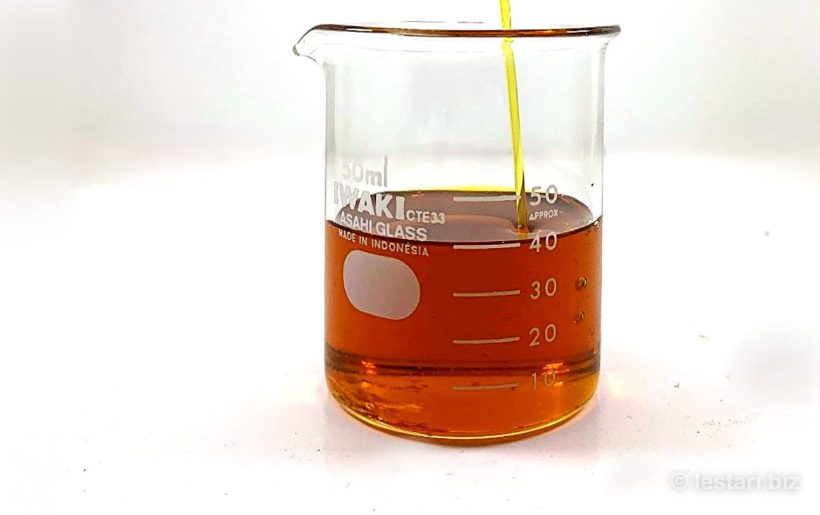 Crude fish oil in laboratory beaker